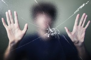 anonymous man with cracked glass effect